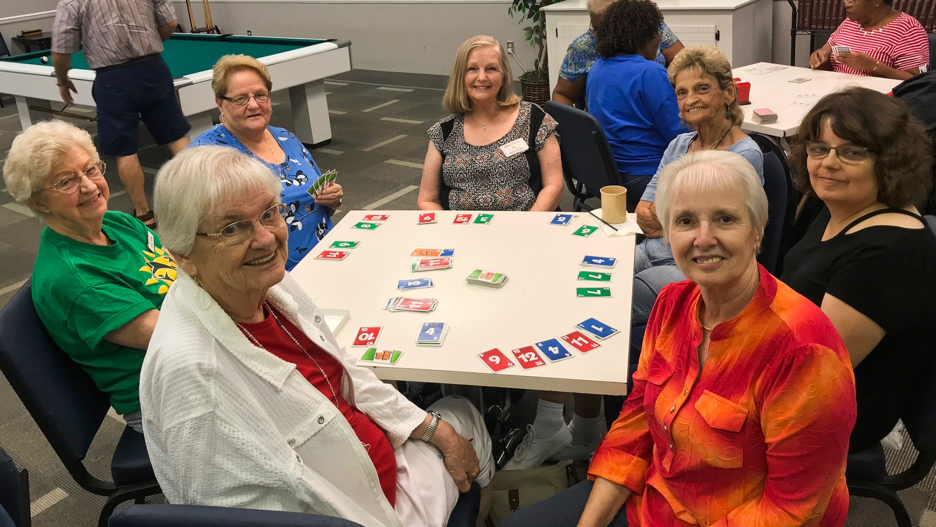 Active Life members piecing puzzles at the center